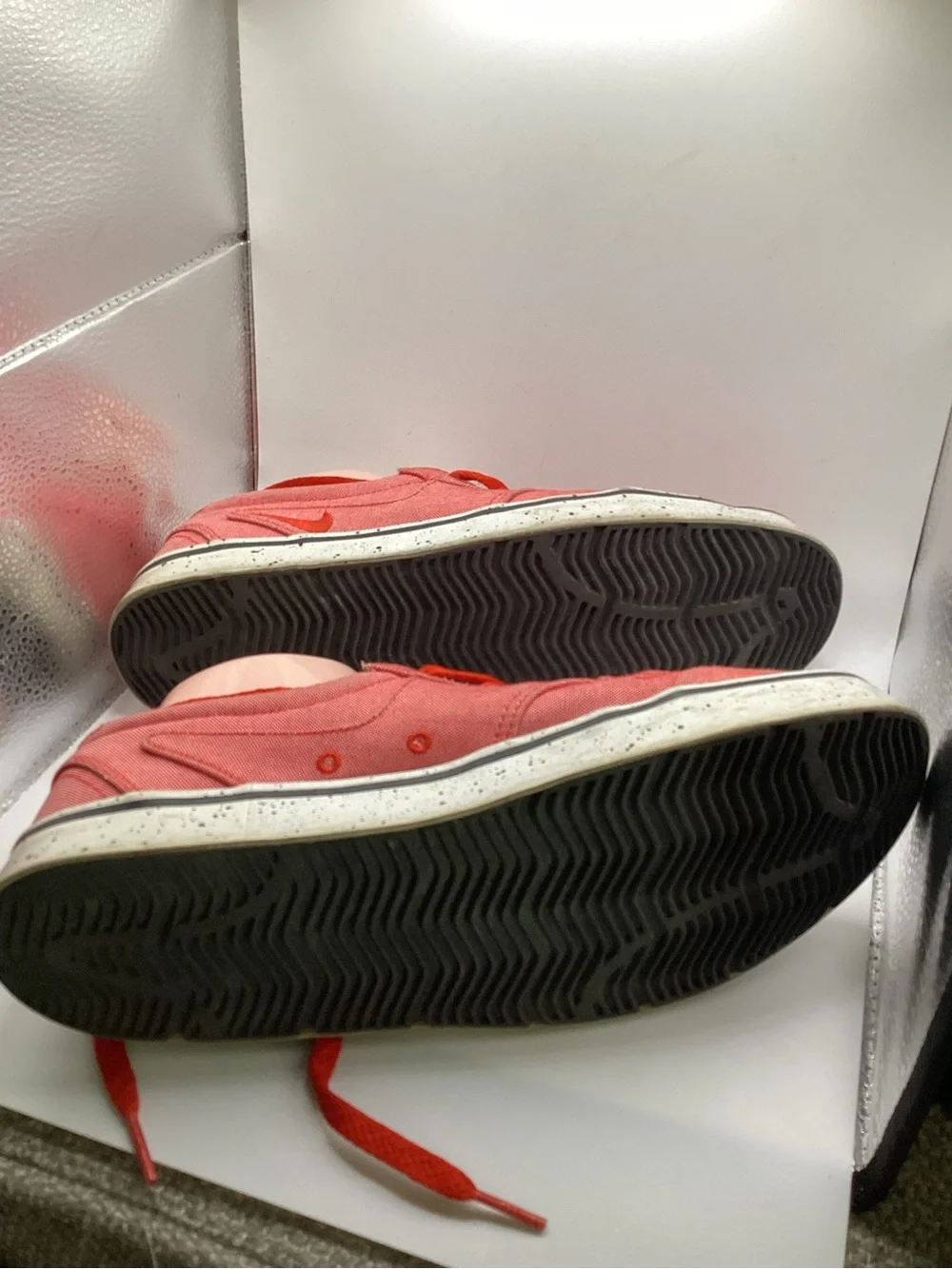 Nike 6.0 skate shoes featuring a vibrant red canvas upper and a speckled midsole